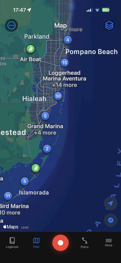 Chart view with clustered marina pins along a coastline